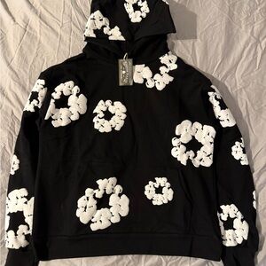 Denim Tears Cotton Wreath Black Hoodie with White Floral Graphic